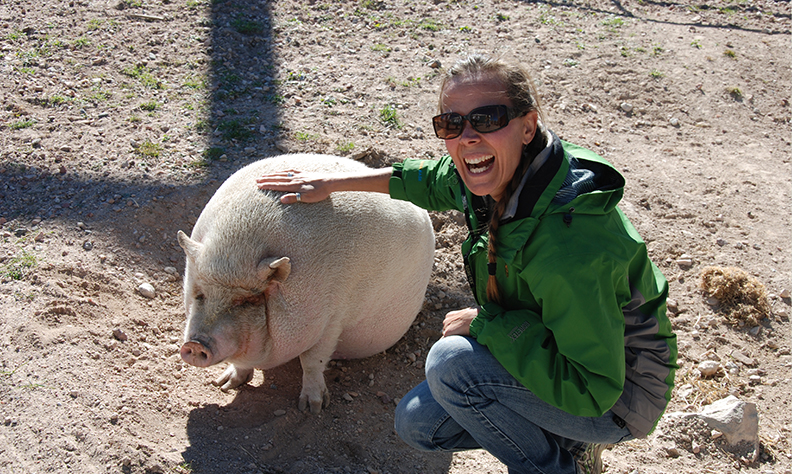Sarah Bexell with a pig