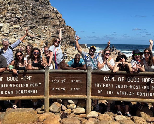 Students posing in front of the sign of Cape of Good Hope