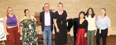 IHAC Executive director with 6 student researchers