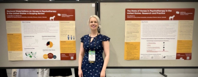 woman with two poster presentations