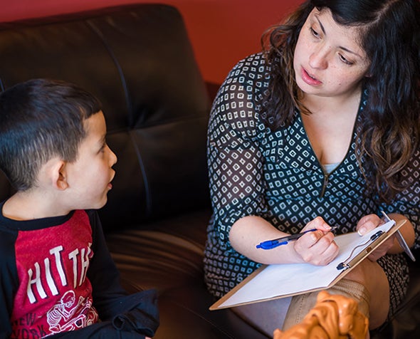 woman talking to child at home visit