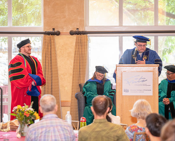 Brendon Holloway PhD Hooding Ceremony and Eugene Walls on the stand