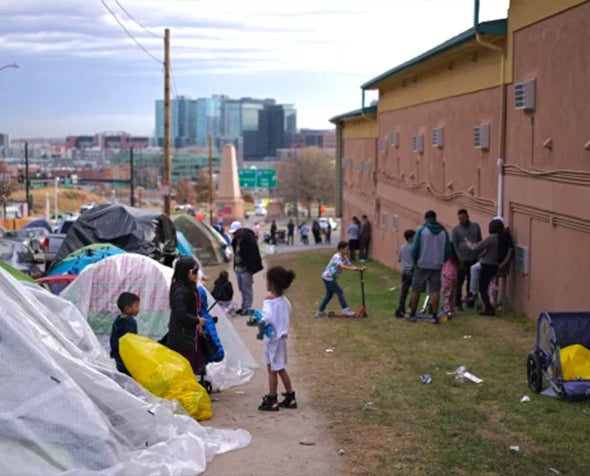 Children play between the campsite and Quality Inn Denver Downtown on Nov. 16.