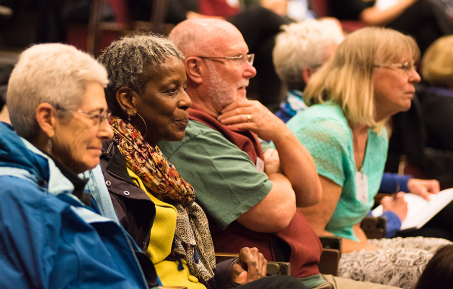 Four elder adults at an event