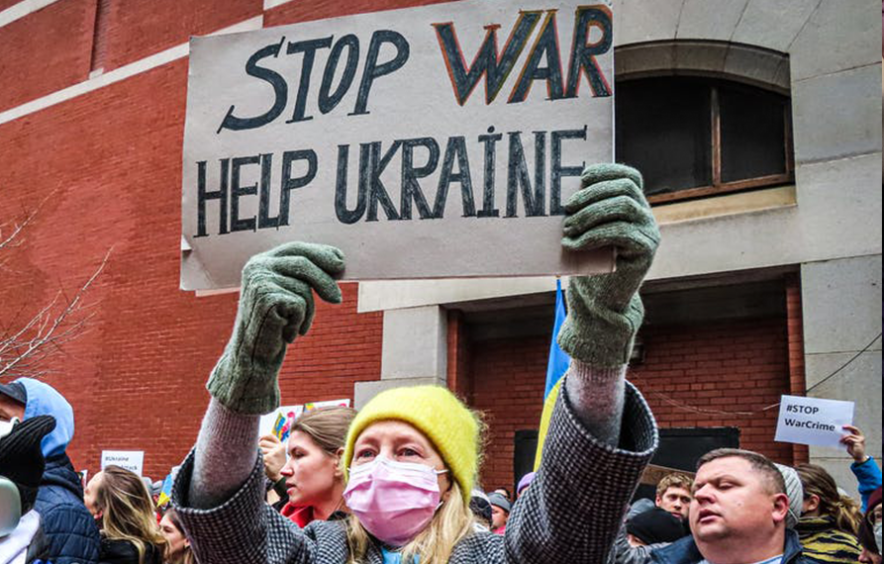 female with stop war help ukraine sign