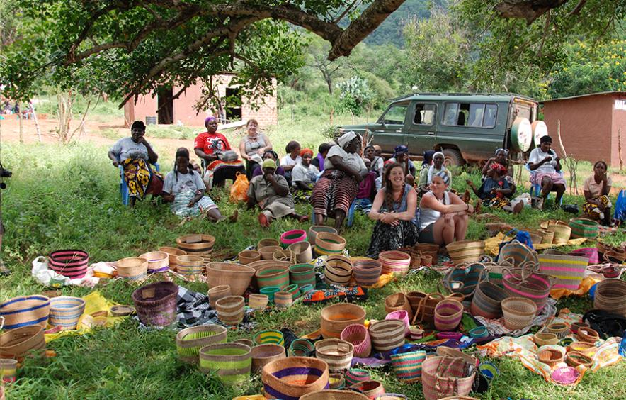 Students at a women's basket weaving cooperative in Kenya