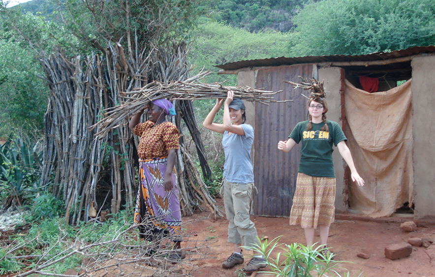 students carrying sticks