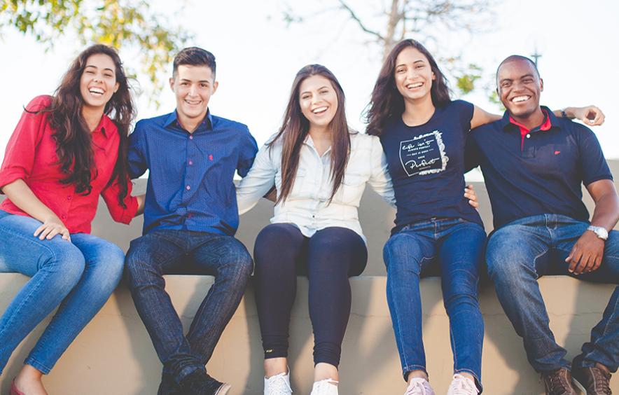 Interns sitting on wall