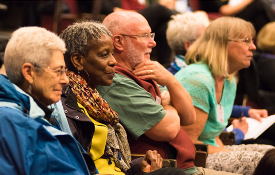older adults watching a presentation