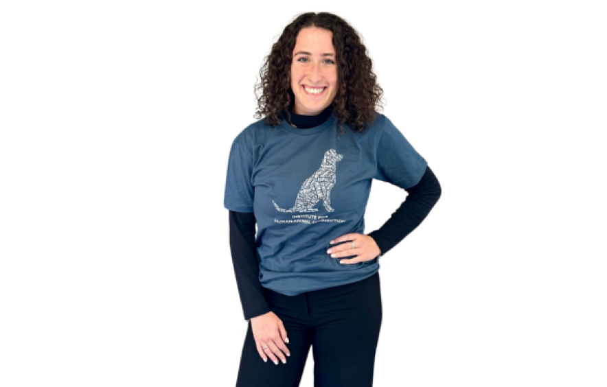 Person wearing a word-cloud style design dog tee shirt in dark blue