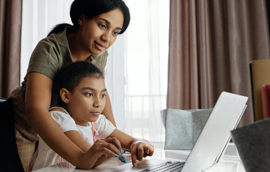 Parent helping child with homework