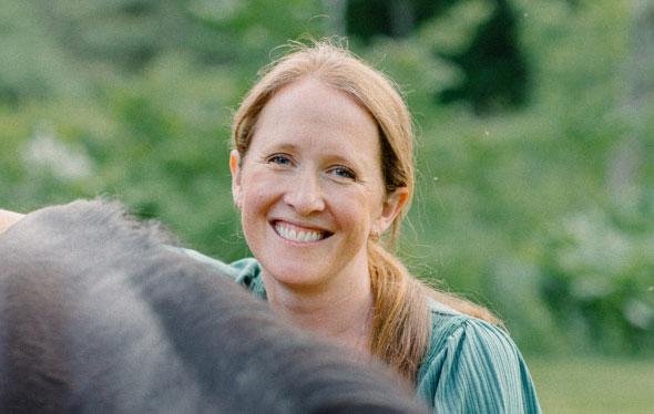 Megan Mueller with a horse outdoors