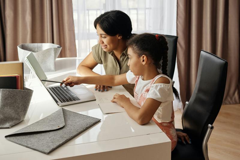 mother and daughter using a computer