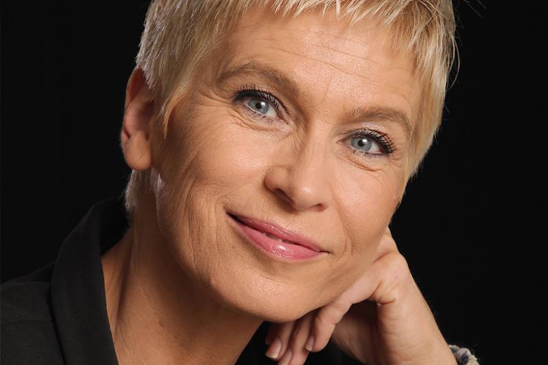Professional headshot of a short haired blond woman 