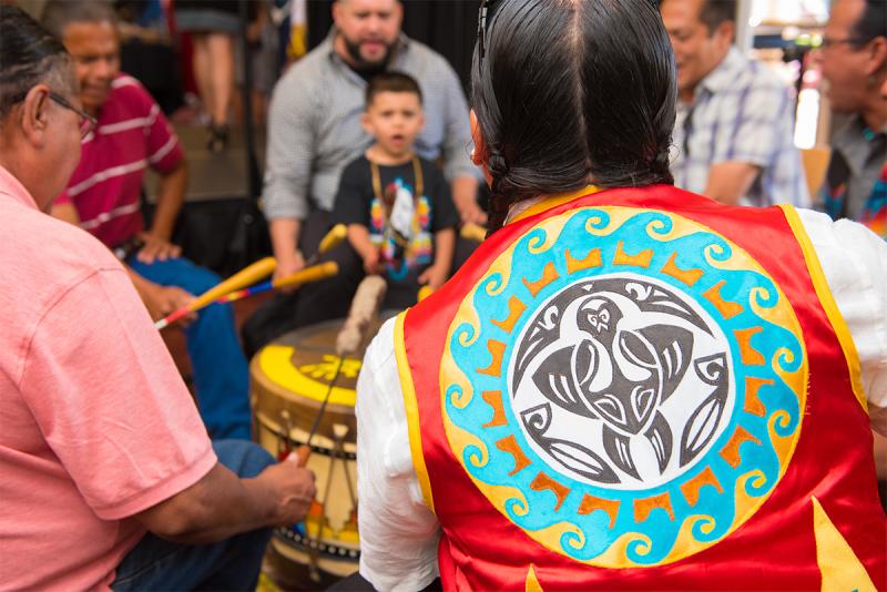 Feature Media Image of indigenous group playing drums