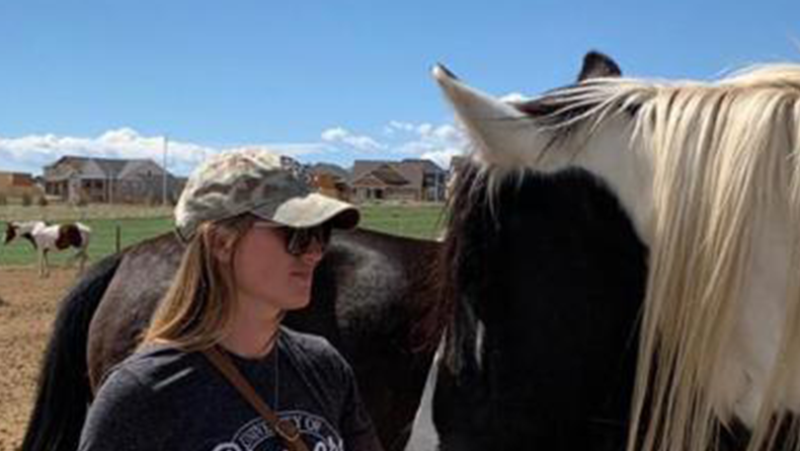 student with horse