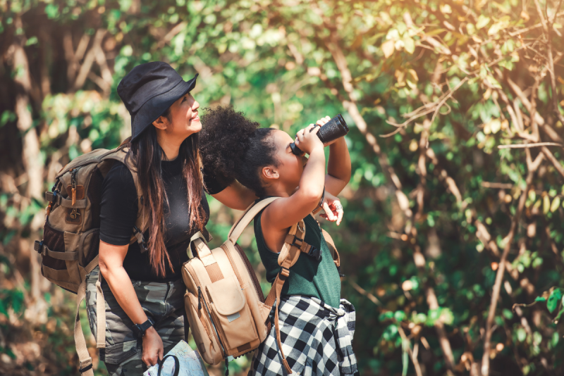 Woman and girl exploring nature