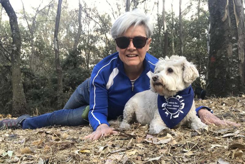 Maria Espinosa de los Monteros with her dog in nature