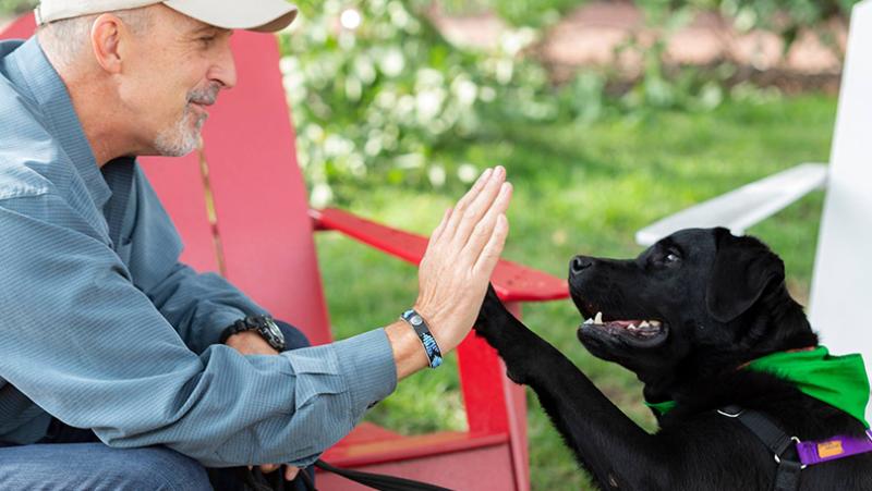 Philip Tedeschi and Therapy dog Samara