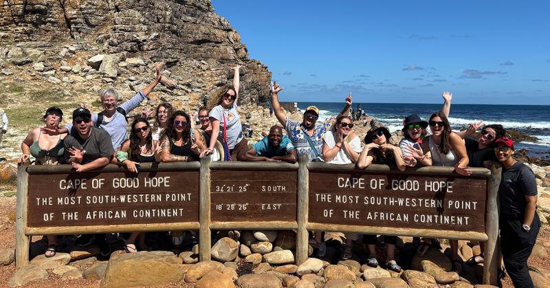 Students posing in front of the sign of Cape of Good Hope