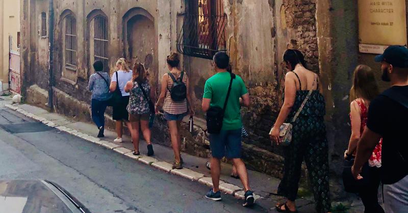 line of people walking down a street