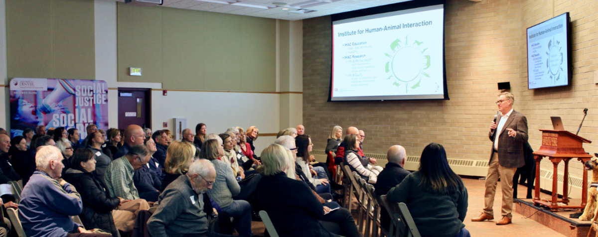 Kevin Morris speaking to a crowd about human-animal interactions
