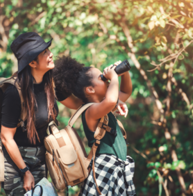 Woman and girl exploring nature