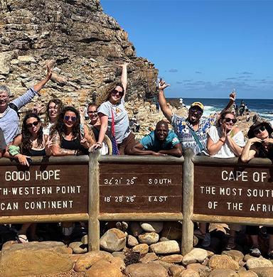 Students posing in front of the sign of Cape of Good Hope