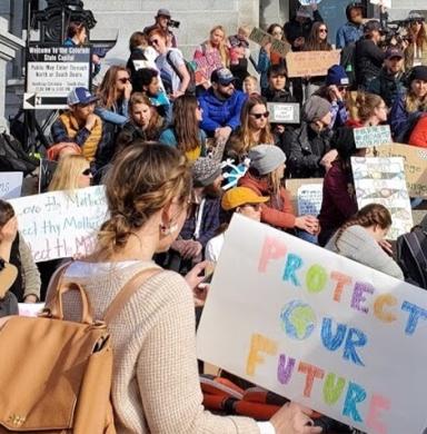 Activists at the 2020 Winter Outdoor Retailer Show climate strike demanding climate action now. Source: Conservation Colorado