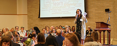woman speaking to audience