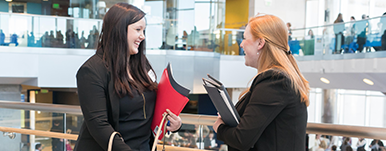 student and employer at field fair