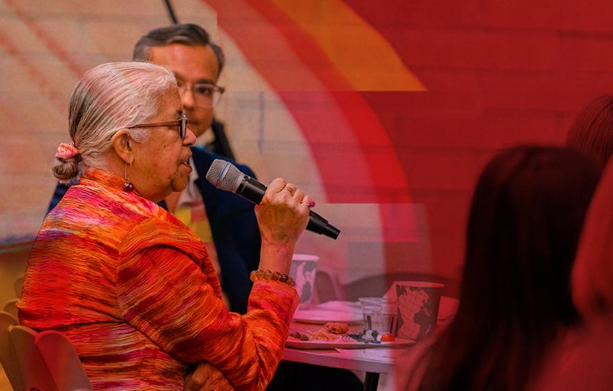 older woman speaking at event