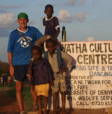Philip Tedeschi with children in Kenya