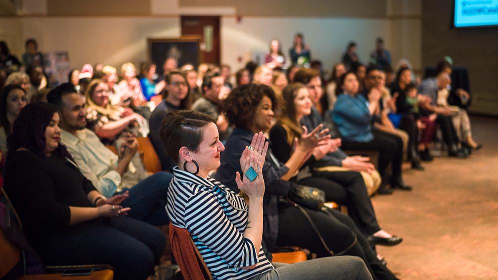 clapping audience members